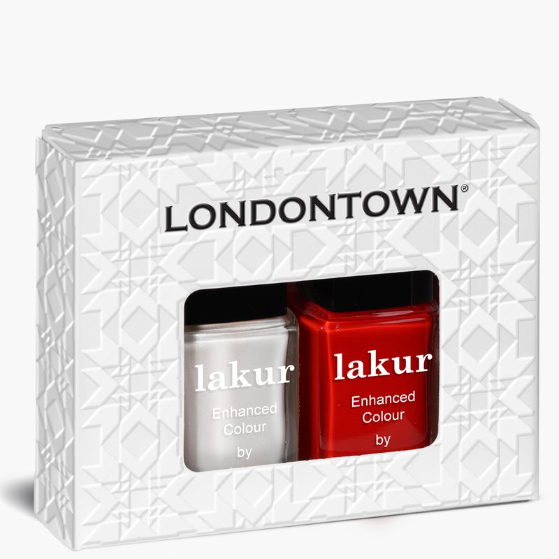 The Frosted Berries Duo by LONDONTOWN offers a boxed set of nail polish featuring two bottles side by side—one white and one red—perfect for creating festive nails with a wintery mix.