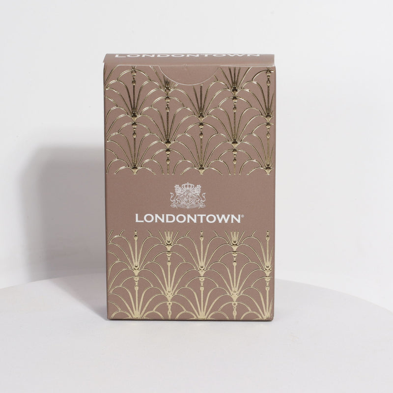A Londontown Parlour Party Playing Cards box, adorned with an elegant brown finish, gold decorative patterns, and a distinguished logo on the front, best appreciated as a display piece for its exquisite design.