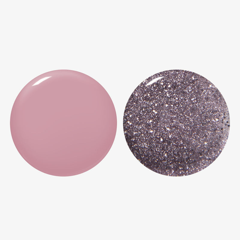LONDONTOWN’s Midnight Frost Duo features two round nail polishes: a solid mauve pink and a fine glitter silver, shown on a white background.