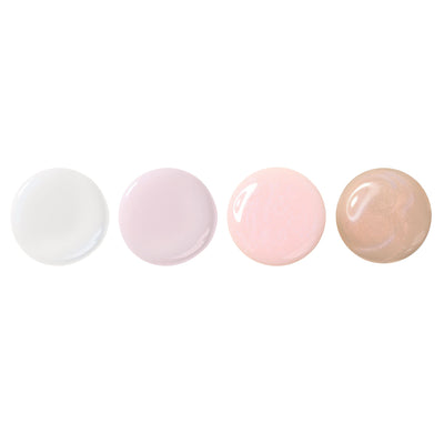 Four round swatches of The Concealer Wardrobe by LONDONTOWN in white, pale lavender, light pink, and beige are arranged on a white background, highlighting this easy-care nail solution for one-step manicures.