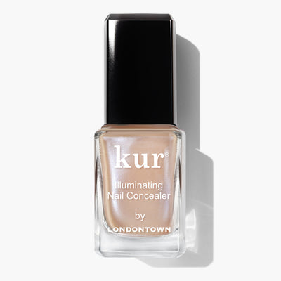 A bottle of Bare Illuminating Nail Concealer (Professional) by LONDONTOWN, featuring a sleek design with a black cap and a lustrous beige polish inside.