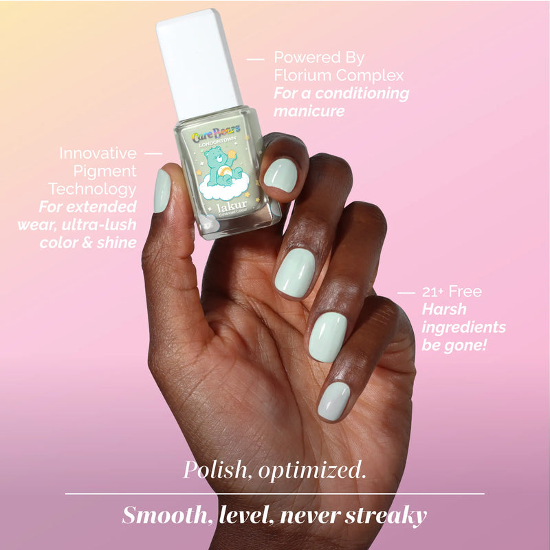 A hand with mint green nail polish holds a matching LONDONTOWN Beary Minty bottle; product benefits are showcased on a pink gradient background, creating an airy, hopeful clarity.