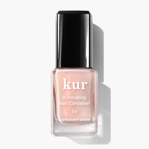 A bottle of LONDONTOWN Bubble Illuminating Nail Concealer in a delightful bubblegum pink shade against a white background, the perfect nail perfector for enhancing your favorite nail look.