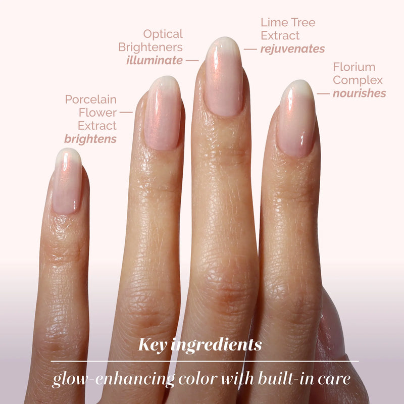 A manicured hand showcases LONDONTOWN Bubble Illuminating Nail Concealer with labels for optical brighteners, lime tree extract, porcelain flower extract, and florum complex to perfect your nails.