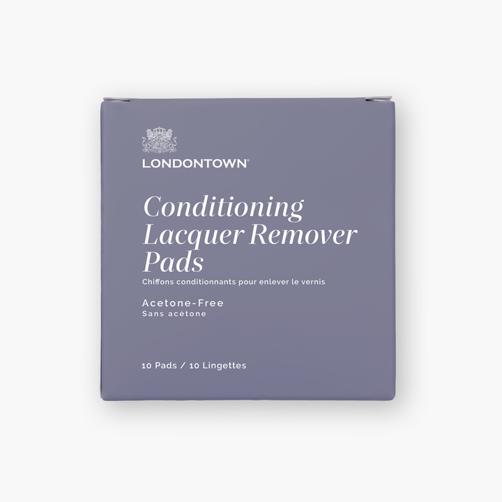 A lavender box labeled “LONDONTOWN Conditioning Lacquer Remover Pads” sits against a white background—perfect for on-the-go nail polish removal.