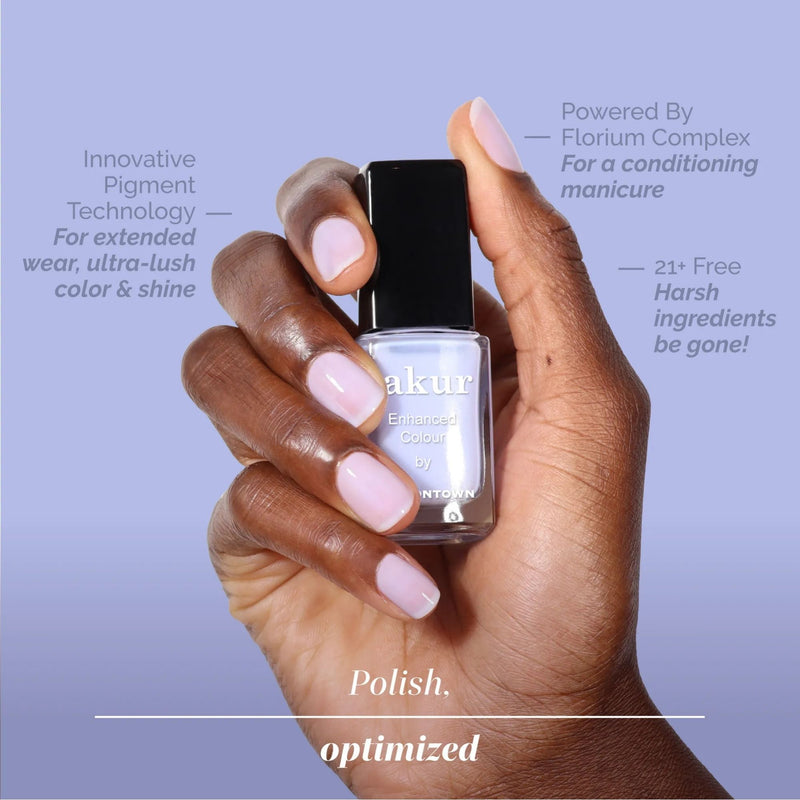 A hand with dreamy periwinkle nail polish holds a bottle labeled "Cloud Nine" by LONDONTOWN, while informative text highlights the polish’s features and benefits.