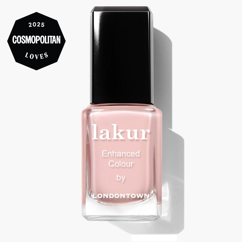 A bottle of LONDONTOWN Invisible Crown Lakur nail polish in sheer pink, shown upright with a 2025 Cosmopolitan Loves award badge in the top left corner.