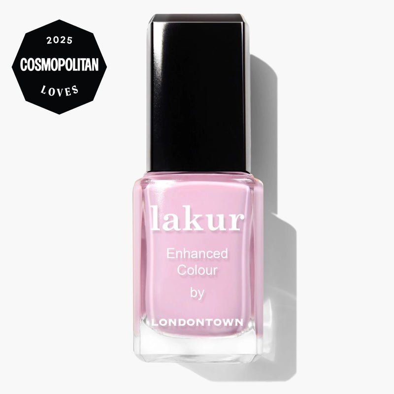 A bottle of LONDONTOWN Pink Palm Lakur Enhanced Colour pastel pink nail polish with a black cap and a "2025 Cosmopolitan Loves" badge in the corner.
