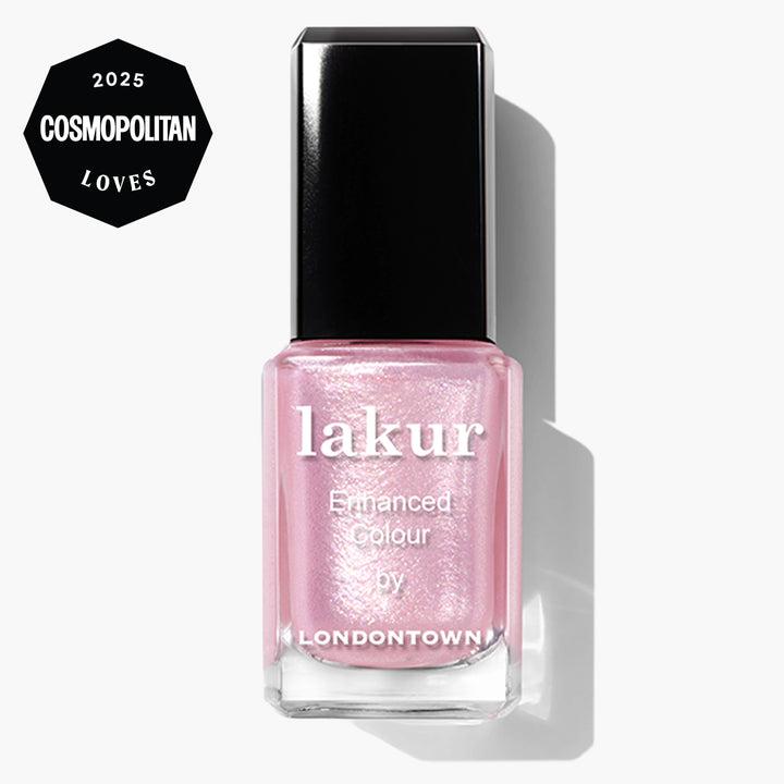 A bottle of LONDONTOWN Pink Strawberry nail polish with ultrafine glitter and a "2025 Cosmopolitan Loves" badge in the top left corner.