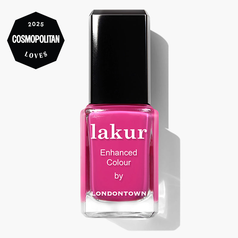 A bottle of LONDONTOWN Summer Fling Lakur Enhanced Colour nail polish in shocking pink, featuring a "2025 Cosmopolitan Loves" badge. This cruelty-free polish delivers bold color with a conscience.