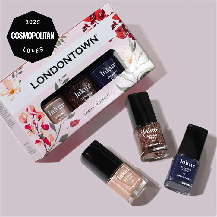 The "Moonlit Botanica Mini lakur trio" by LONDONTOWN features three mini nail polishes—glitter, nude, and navy—in a floral box. Three bottles stand outside the box and a "2025 Cosmopolitan Loves" badge is displayed.
