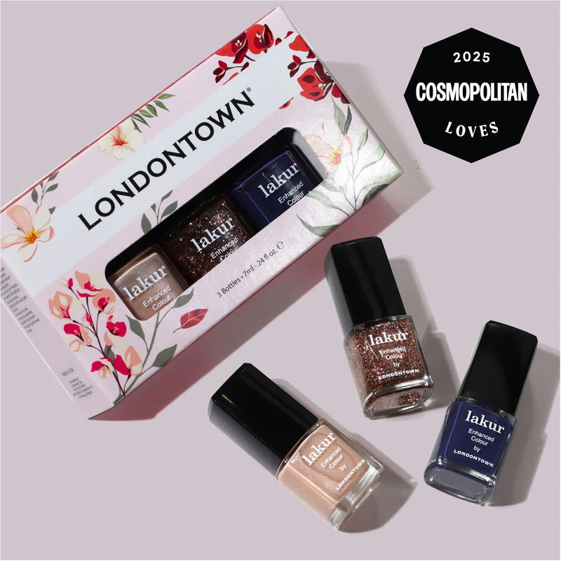 The Moonlit Botanica Mini lakur trio by LONDONTOWN is shown with three nail polish bottles outside its floral box, featuring a "2025 Cosmopolitan Loves" badge in the top right corner.