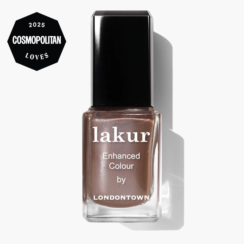 A bottle of LONDONTOWN Lakur Enhanced Colour nail polish in the shade Affogato, a shimmering metallic brown, is shown against a white background with a Cosmopolitan Loves 2025 badge in the top left corner.