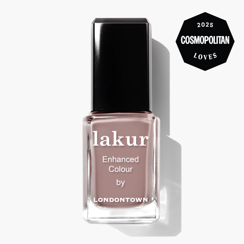 A bottle of LONDONTOWN lakur Enhanced Colour nail polish in the neutral mauve shade "Chai," featuring a "2025 Cosmopolitan Loves" badge in the top right corner.