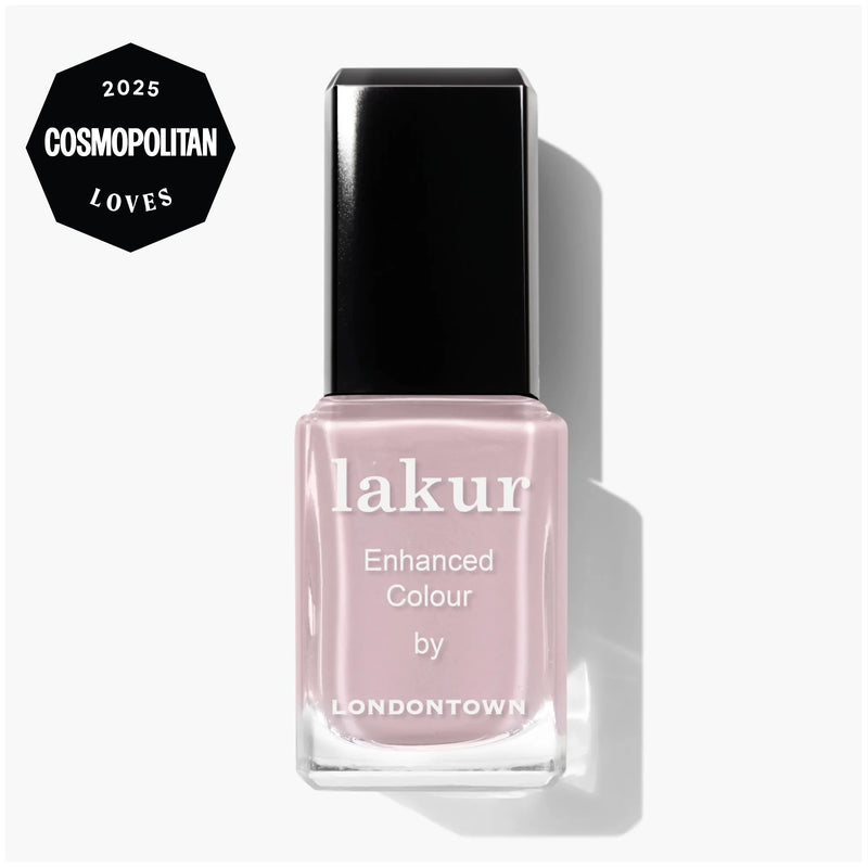 A bottle of LONDONTOWN Dream State Lakur Enhanced Colour nail polish, a light pink demi-sheer cream shade, is shown beside a 2025 Cosmopolitan Loves award badge.