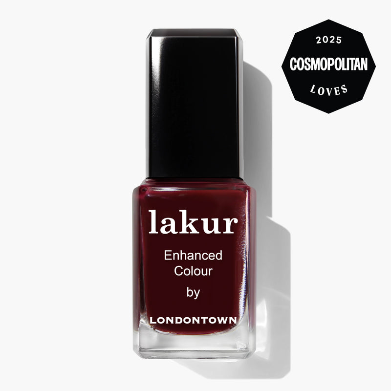 A bottle of LONDONTOWN Lakur Enhanced Colour nail polish in the "Elderberry" dark red shade, featuring a "2025 Cosmopolitan Loves" badge in the top right corner.