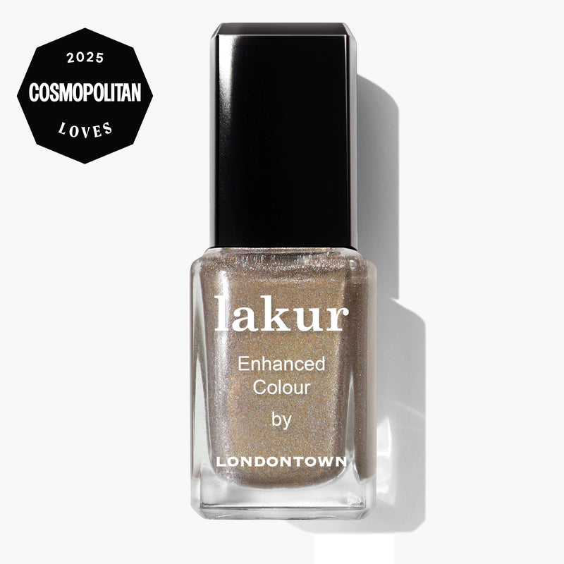 A bottle of LONDONTOWN lakur Enhanced Colour nail polish in the "You're Golden" holographic gold shade, featuring a "2025 Cosmopolitan Loves" badge in the top left corner.