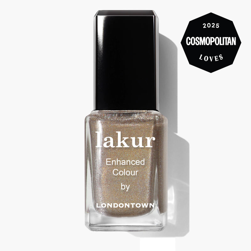 A bottle of LONDONTOWN Lakur nail polish in the "You're Golden" shimmery holographic gold shade, featuring a "2025 Cosmopolitan Loves" badge in the top right corner.