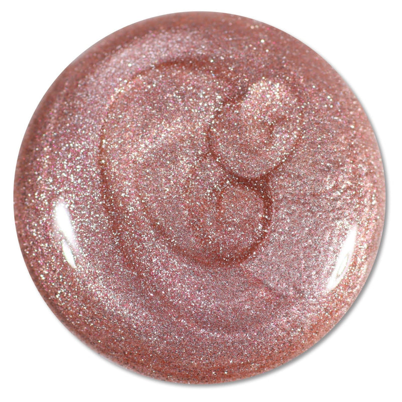 A circular swatch of LONDONTOWN’s “Extra Bubbles, Please” nail polish in shimmering mauve gold with fine glitter, displayed on a white background.