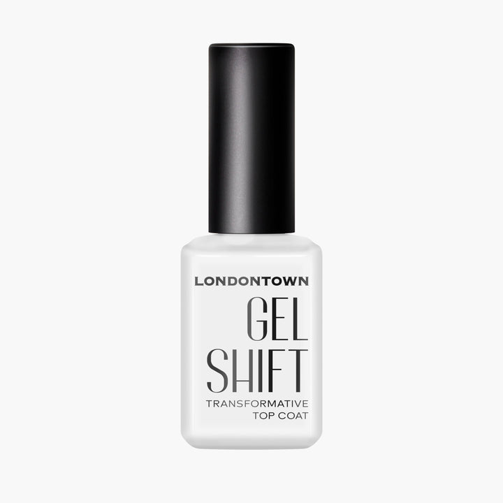 A white bottle of LONDONTOWN GelShift Top Coat with a black cap is shown against a plain background, ideal for sealing your gel manicure or adding shine to your favorite polish.