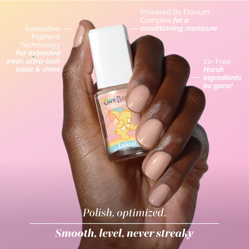 A hand with neatly manicured nails holds a bottle of sunlit peach nude nail polish labeled "Good Vibes Only" by LONDONTOWN. Text highlights the warm, inviting features of the product around the hand.