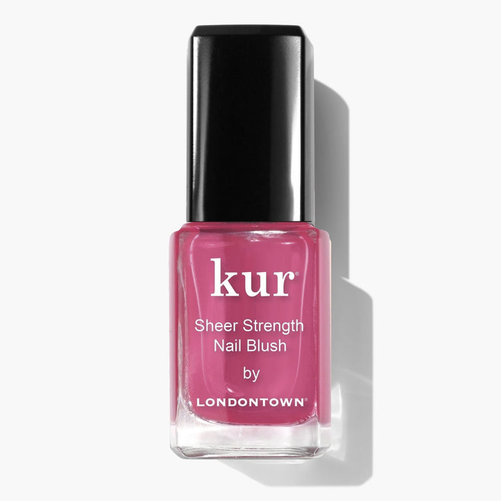 A bottle of LONDONTOWN Sheer Strength Nail Blush - Hibiscus with a black cap sits on a white background, offering a glow booster for radiant, pink-tinted nails.