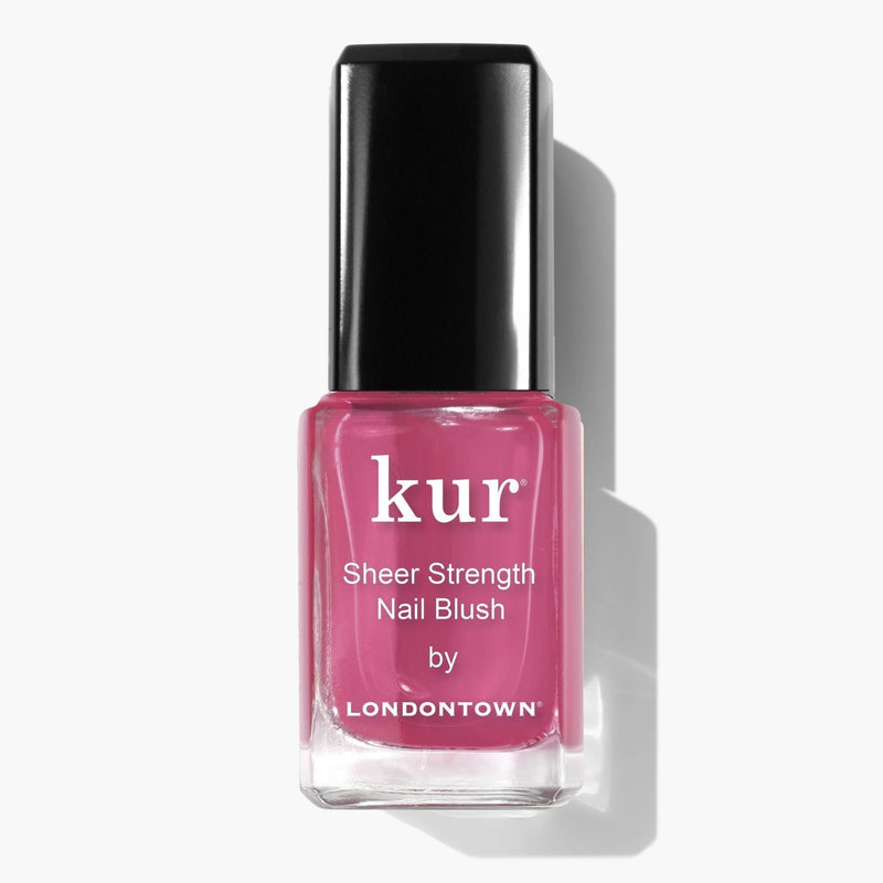 A bottle of LONDONTOWN Sheer Strength Nail Blush - Hibiscus with a black cap sits on a white background, offering a glow booster for radiant, pink-tinted nails.