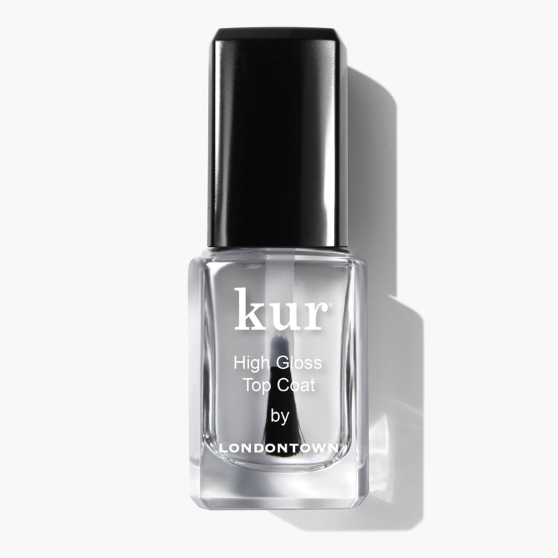 A bottle of LONDONTOWN's High Gloss Top Coat nail polish, featuring a black cap and offering a super shiny finish, displayed against a white background.