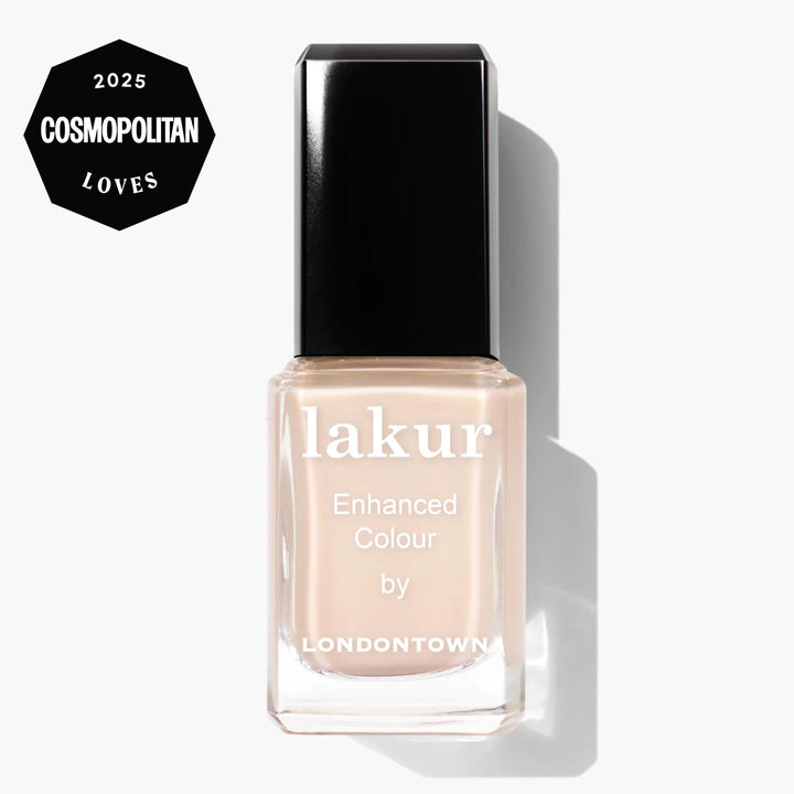 LONDONTOWN Room Service lakur nail polish in a peachy nude shade, featuring "Enhanced Colour by Londontown" text and a "2025 Cosmopolitan Loves" badge on the bottle.