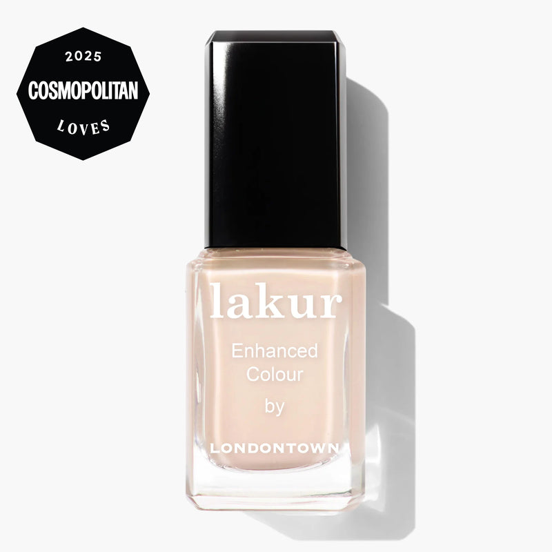LONDONTOWN Room Service lakur nail polish in a peachy nude shade, featuring "Enhanced Colour by Londontown" text and a "2025 Cosmopolitan Loves" badge on the bottle.