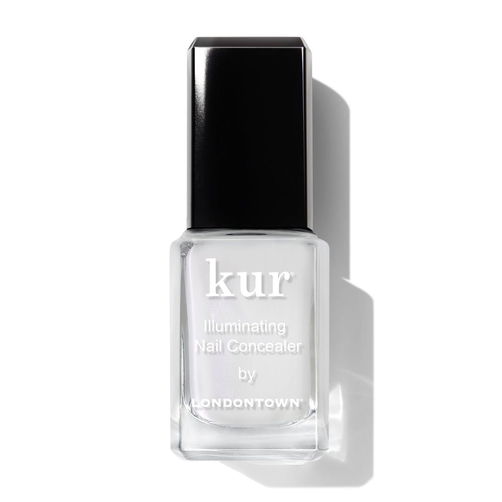 A bottle of Kur Illuminating Nail Concealer by Londontown, featuring a black cap and a transparent bottle showing the light-colored liquid inside.