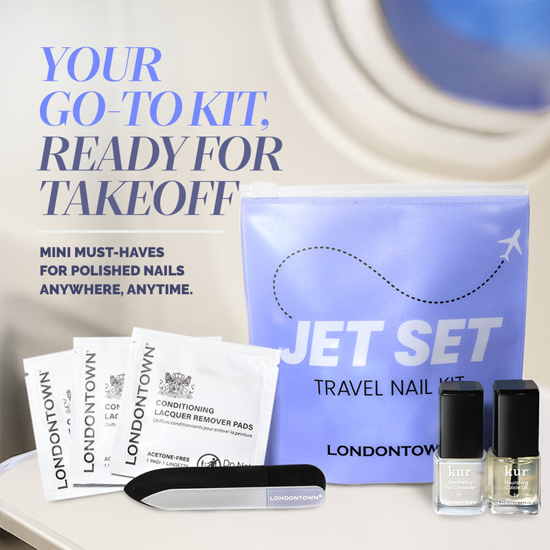 The Jet Set Travel Nail Kit by LONDONTOWN includes remover pads, a nail file, two mini polishes, and a branded pouch—ideal for on-the-go manis—shown against a purple background.