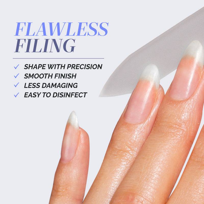 A close-up of manicured nails being filed with LONDONTOWN's Jet Set Travel Nail Kit, featuring a glass file for precision, smooth finish, less damage, and easy disinfection—perfect for on-the-go manis.