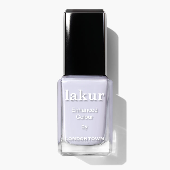 A bottle of LONDONTOWN Frostbitten Lakur Enhanced Colour nail polish with a black cap and a light lavender shade that has a subtle hint of ice blue.