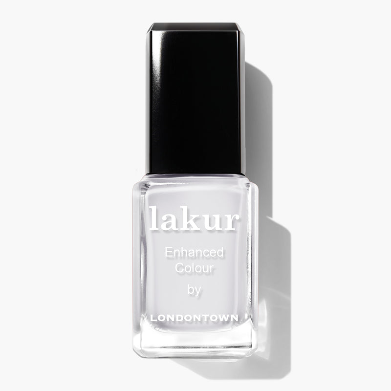A bottle of London Fog Lakur Enhanced Colour nail polish by LONDONTOWN, featuring a rectangular transparent glass bottle and a black cap, offering a crisp, cool touch to your manicure.