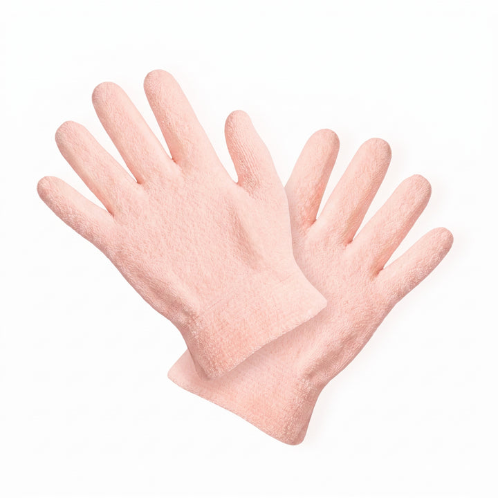 The LONDONTOWN Mani Perfect Spa Gloves, a pair of light pink exfoliating gloves for hand care, are displayed on a white background—perfect for bringing a touch of luxury to your downtime routine.