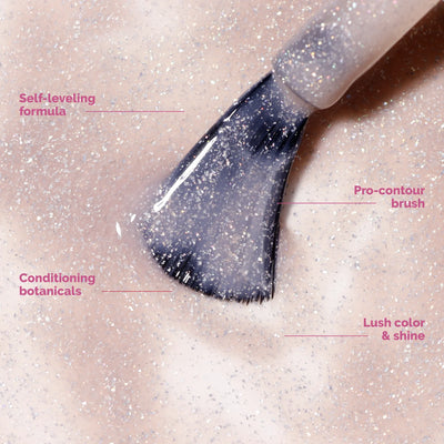 The LONDONTOWN Merry Minis Set features a pro-contour brush coated in shimmery light pink polish, with a self-leveling formula and conditioning botanicals for vibrant holiday manis in lush, cheerful shades.