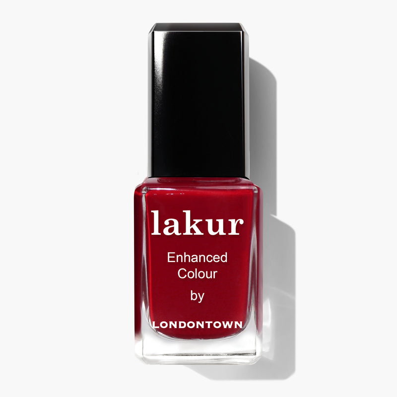 A bottle of LONDONTOWN Mull It Over nail polish, filled with decadent burgundy nail polish and featuring a black cap.
