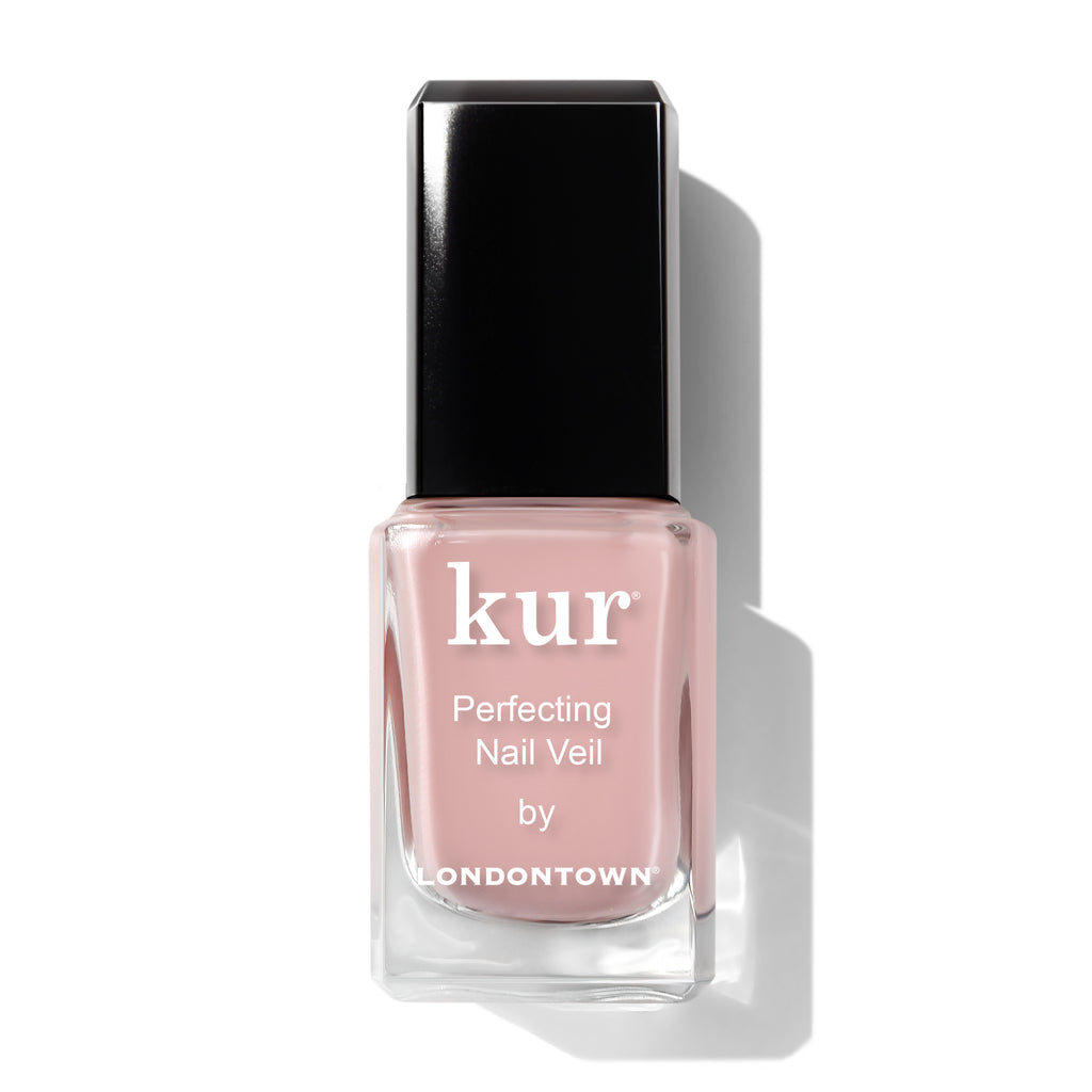 Bottle of Londontown kur Perfecting Nail Veil in a light pink shade, with a black cap, shown against a white background.