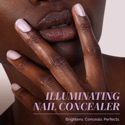 Close-up of a person with medium-dark skin tone touching their face, showing light pink polished nails. Text reads: "One-Step Hero Minis by LONDONTOWN. Brightens, conceals, and perfects nails—care and color in one step.