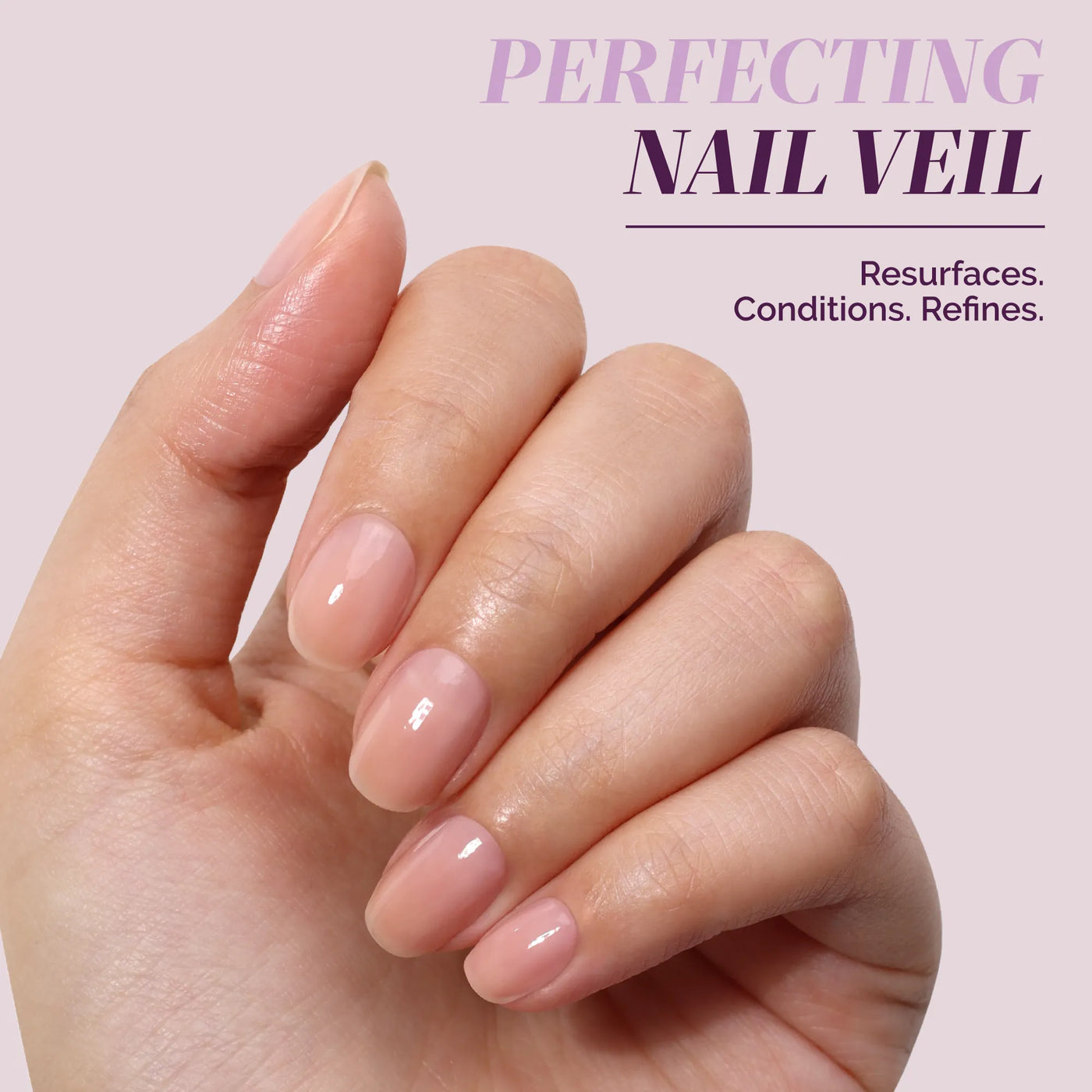 A hand with neatly manicured, natural-looking nails is shown against a pale background with the text "LONDONTOWN One-Step Hero Minis: Color and care that resurfaces, conditions, and refines.