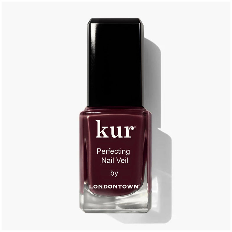 LONDONTOWN Perfecting Nail Veil #10 is a deep burgundy polish that cares for nails while adding rich color. It features a sleek black cap and crisp white label text.