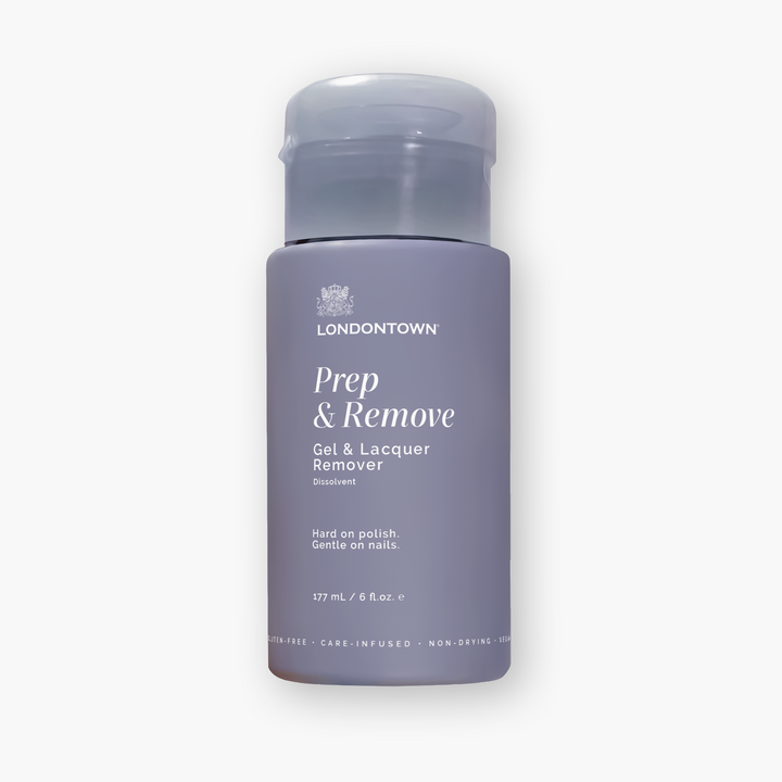 Certainly! Here is your revised sentence using the provided product data: A bottle of LONDONTOWN Prep & Remove Lacquer Remover, 177 mL, featuring a light purple label and a gray cap—sorry, no additional product details are available at this time.