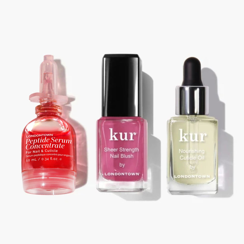 Experience the Peptide Treat, Nourish & Perfect Set by LONDONTOWN—three nail essentials in elegant glass bottles: a red serum concentrate, sheer pink strength nail blush, and clear nourishing cuticle oil—all expertly formulated for stronger, healthier-looking nails.