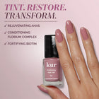 A hand with manicured pink nails holds a bottle of LONDONTOWN Perfecting Nail Veil #11, with product benefits listed on a mauve background—perfectly capturing the elegance of beauty essentials like nourishing lip care and tinted lip balm.
