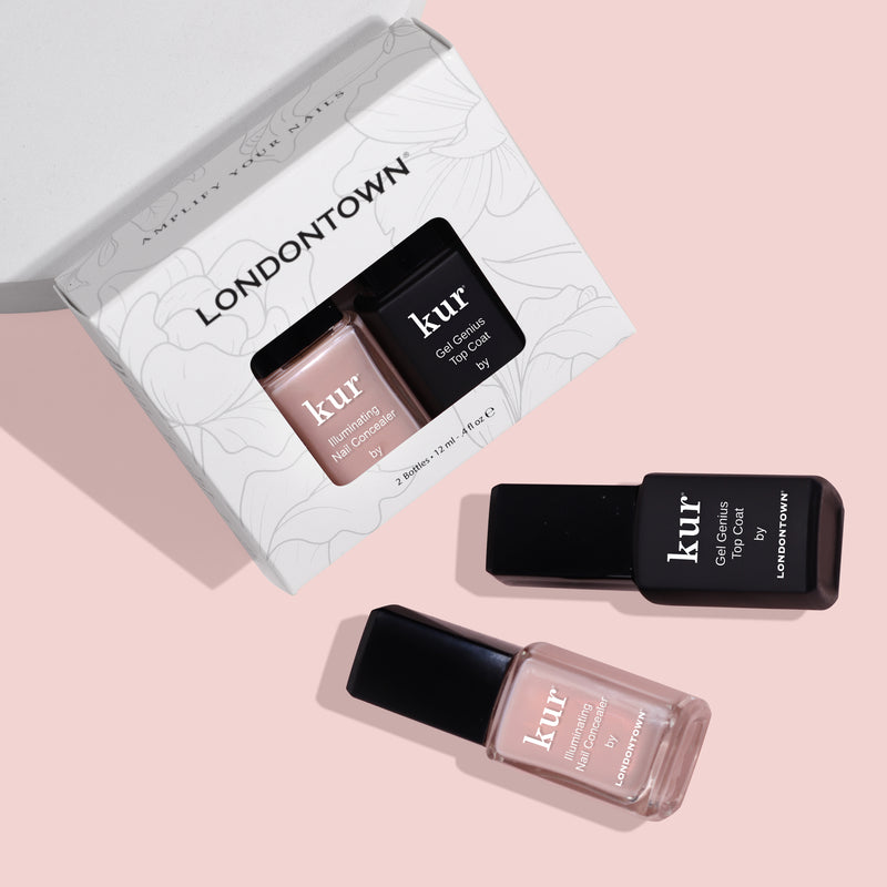 A box labeled "LONDONTOWN" with two bottles of nail care products is on a pink surface. One bottle is labeled "Gel Genius Top Coat" and the other "Conceal + Go Bubble," both designed to help you achieve naturally perfect nails.