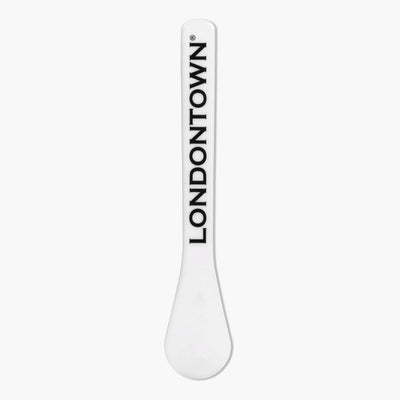 Close-up of a white Londontown Spatula with "LONDONTOWN" printed in black vertically.