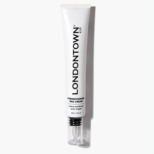 A 28ml white tube of LONDONTOWN Strengthening Nail Cream with a silver cap is pictured on a white background. This nourishing formula helps fortify and condition nails, promoting strength and healthy growth with regular use.