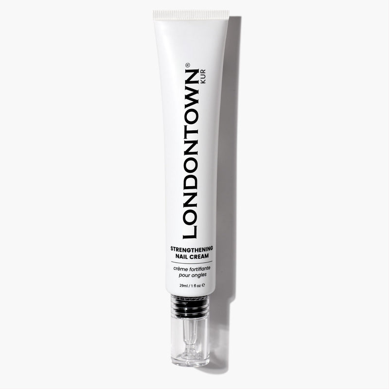 A 28ml white tube of LONDONTOWN Strengthening Nail Cream with a silver cap is pictured on a white background. This nourishing formula helps fortify and condition nails, promoting strength and healthy growth with regular use.