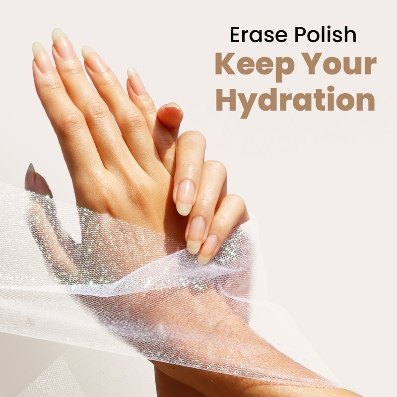 Hands with long nails held together, partially wrapped in a translucent fabric. Text reads: "Remove Polish, Preserve Your Hydration with LONDONTOWN's vegan, cruelty-free Strengthening Lacquer Remover.